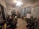 Sunroom features a ceiling fan and comfortable seating for relaxation at 501 Heritage Trail St, Kissimmee, FL 34759