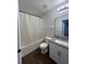 Bathroom with shower/tub combo, granite vanity, and tile floor at 572 Cresting Oak Cir # 19, Orlando, FL 32824