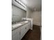 Bathroom with granite countertops, double sinks, and a shower/tub combo at 572 Cresting Oak Cir # 19, Orlando, FL 32824