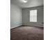 Spacious bedroom with neutral-colored carpeting at 572 Cresting Oak Cir # 19, Orlando, FL 32824