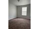 Large bedroom with brown carpet and window coverings at 572 Cresting Oak Cir # 19, Orlando, FL 32824
