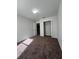 Spacious bedroom with plush carpeting and a large closet at 572 Cresting Oak Cir # 19, Orlando, FL 32824