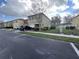 Two-story house with a car parked in front at 572 Cresting Oak Cir # 19, Orlando, FL 32824