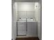 Laundry room with washer and dryer in a closet at 572 Cresting Oak Cir # 19, Orlando, FL 32824