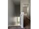Upstairs hallway with carpet and access to bedrooms at 572 Cresting Oak Cir # 19, Orlando, FL 32824