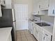 Simple kitchen with white cabinets and stainless steel appliances at 5835 W Amelia St, Orlando, FL 32835