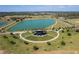 Aerial view showing a park with a large lake and amphitheater at 684 Bishop Bay Loop, Apopka, FL 32712