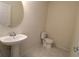 Clean powder room with pedestal sink and tile floor at 684 Bishop Bay Loop, Apopka, FL 32712