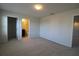 Bright bedroom featuring neutral walls, carpet and ensuite bathroom at 684 Bishop Bay Loop, Apopka, FL 32712