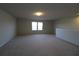 Bright bonus room featuring neutral walls and carpet at 684 Bishop Bay Loop, Apopka, FL 32712