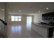 Open floor plan connecting living room and kitchen at 684 Bishop Bay Loop, Apopka, FL 32712