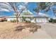 Ranch-style home with mature landscaping and a long driveway at 7201 Pleasant Dr, Orlando, FL 32818