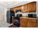 Modern kitchen with dark wood cabinets and appliances at 7201 Pleasant Dr, Orlando, FL 32818