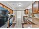 Bright kitchen with ample cabinetry and modern appliances at 7201 Pleasant Dr, Orlando, FL 32818