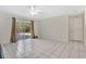 Spacious living room with sliding glass doors to backyard at 7201 Pleasant Dr, Orlando, FL 32818