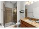 Bathroom with shower, toilet, and granite countertop vanity at 8931 Bismarck Palm Rd, Kissimmee, FL 34747