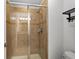 Shower stall with glass enclosure and tile surround at 8931 Bismarck Palm Rd, Kissimmee, FL 34747