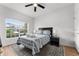 Cozy bedroom with a double bed, rug, and large window at 8931 Bismarck Palm Rd, Kissimmee, FL 34747
