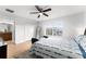 Spacious bedroom with a king-size bed, en-suite bathroom access, and large closet at 8931 Bismarck Palm Rd, Kissimmee, FL 34747