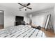 Comfortable bedroom with king bed, TV, and large closet at 8931 Bismarck Palm Rd, Kissimmee, FL 34747