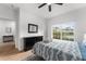 Bright bedroom with a queen bed, dresser, and view of the backyard at 8931 Bismarck Palm Rd, Kissimmee, FL 34747