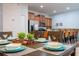 Bright dining room with table set for dinner at 8931 Bismarck Palm Rd, Kissimmee, FL 34747