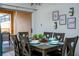 Dining area with table, chairs, and access to the back patio at 8931 Bismarck Palm Rd, Kissimmee, FL 34747