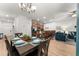 Dining area with table and chairs, view into kitchen and living room at 8931 Bismarck Palm Rd, Kissimmee, FL 34747