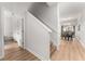 Bright interior hallway with light wood floors, showing access to other rooms at 8931 Bismarck Palm Rd, Kissimmee, FL 34747