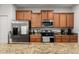 Modern kitchen with stainless steel appliances at 8931 Bismarck Palm Rd, Kissimmee, FL 34747