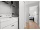 Convenient laundry room with washer, dryer, and shelving at 8931 Bismarck Palm Rd, Kissimmee, FL 34747
