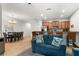 Open concept living area with blue sofa and kitchen views at 8931 Bismarck Palm Rd, Kissimmee, FL 34747
