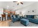 Relaxing living room with blue sectional sofa and ottoman at 8931 Bismarck Palm Rd, Kissimmee, FL 34747