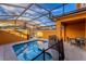 Private screened pool and patio with seating at 8931 Bismarck Palm Rd, Kissimmee, FL 34747