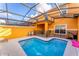Private screened pool and patio with seating area at 8931 Bismarck Palm Rd, Kissimmee, FL 34747