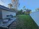 Backyard patio with seating and grassy area at 1022 Bartlett Ct, Oviedo, FL 32765