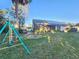 Backyard with a swing set and a view of the house at 1022 Bartlett Ct, Oviedo, FL 32765