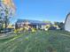 Backyard view, showing a large grassy area and solar panels at 1022 Bartlett Ct, Oviedo, FL 32765