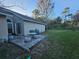 Private backyard with patio and grassy area at 1022 Bartlett Ct, Oviedo, FL 32765