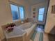Bathroom with garden tub and large window at 1022 Bartlett Ct, Oviedo, FL 32765