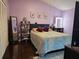 Spacious bedroom with dark wood floors, and plenty of natural light at 1022 Bartlett Ct, Oviedo, FL 32765