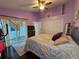 Bedroom with sliding doors to a patio at 1022 Bartlett Ct, Oviedo, FL 32765