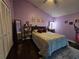 Comfortable bedroom with dark wood floors, and ceiling fan at 1022 Bartlett Ct, Oviedo, FL 32765