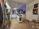 Well-equipped kitchen with island, granite countertops, and white cabinetry at 1022 Bartlett Ct, Oviedo, FL 32765
