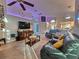 Bright living room with comfortable seating and large TV at 1022 Bartlett Ct, Oviedo, FL 32765