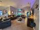 Living room with leather sofas and a large TV at 1022 Bartlett Ct, Oviedo, FL 32765