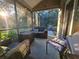 Relaxing screened porch with seating and a hammock at 1022 Bartlett Ct, Oviedo, FL 32765