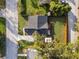 Aerial view of a house with a backyard and driveway at 1441 Dann St, Orlando, FL 32804