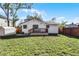 House with backyard, shed, and wooden fence at 1441 Dann St, Orlando, FL 32804