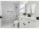 Updated bathroom with marble tile and new vanity at 1441 Dann St, Orlando, FL 32804